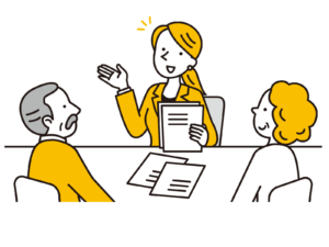 シニアメンバーに話をする女性社員